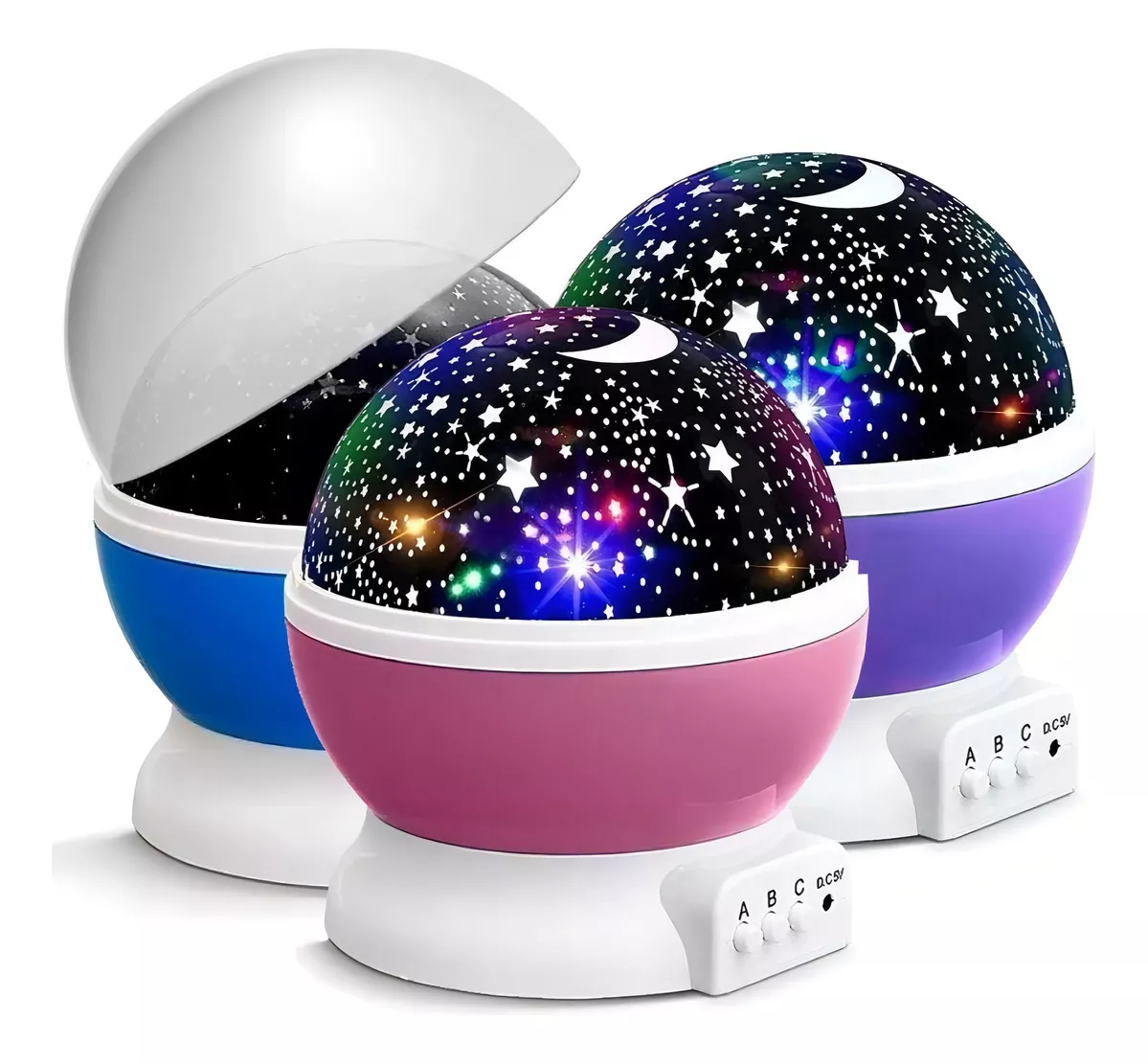 Tres proyectores de estrellas LED con base blanca y cúpula en colores azul, rosa y morado, uno con cubierta semitransparente removida.