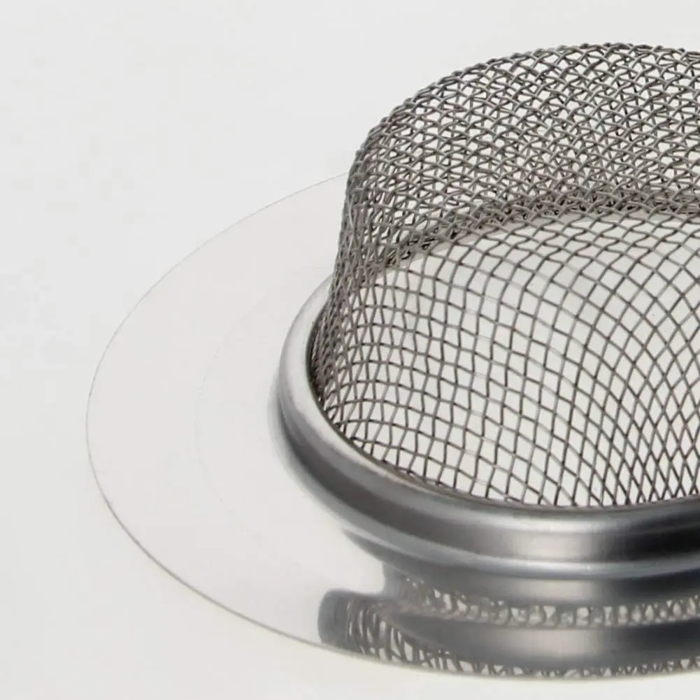 Colador de malla de acero inoxidable para lavaplatos con borde circular pulido y textura de rejilla fina en color plateado.