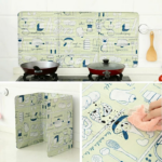 Protector de salpicaduras plegable de tres paneles con diseño de utensilios de cocina en tonos verde y azul, ideal para evitar manchas de grasa en paredes.