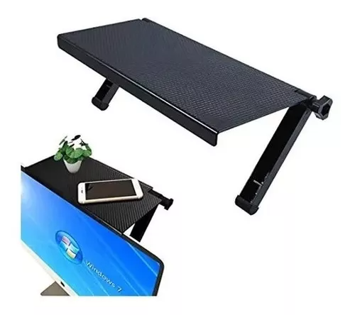 Estante superior negro para monitor y TV con superficie texturizada, patas ajustables con perilla de ajuste y vista secundaria sobre pantalla con teléfono y planta decorativa.
