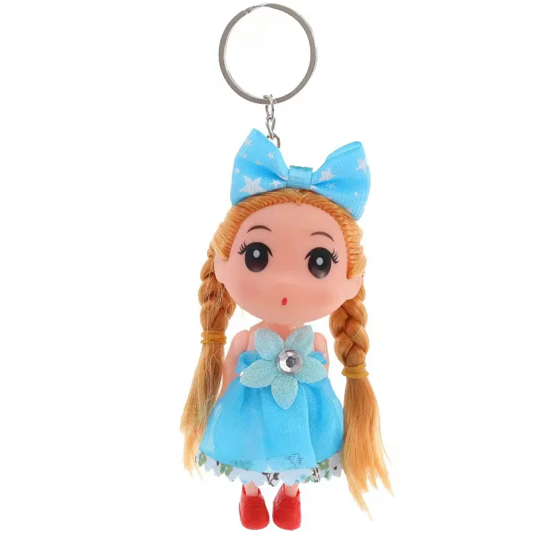Llavero de muñeca de plástico con trenzas rubias, vestido azul con flor brillante, lazo de estrellas y zapatos rojos para decorar bolsos.