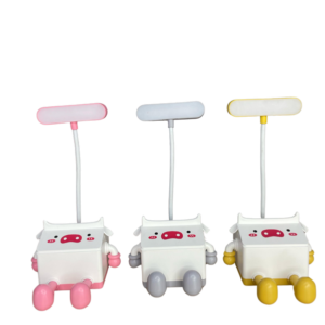 Lámparas de vaca LED con cuerpo blanco y detalles en rosa, gris y amarillo. Diseño cúbico infantil con cara tierna para luz nocturna.
