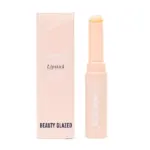 Bálsamo labial Beauty Glazed en empaque rosa claro, incluye caja y barra con tapa, formato de 2g/0.07oz, diseñado para reparación e hidratación intensa.