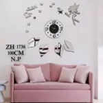 Reloj de pared 3D plateado de 100 cm, diseño con hada, estrellas y hojas adhesivas sobre sofá rosa