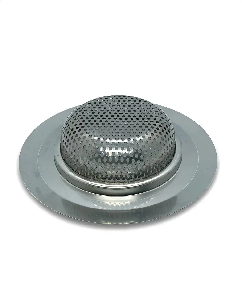Canastilla de eje de clutch metálica plateada con superficie perforada en domo y base circular plana, vista en ángulo.