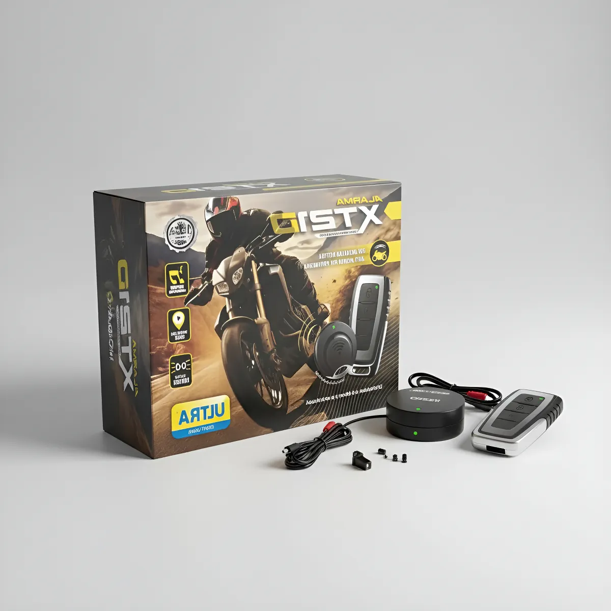 Caja de alarma para moto negra y dorada junto a un sensor redondo, llavero remoto y cables sobre superficie blanca.