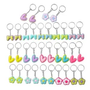 Set x2 Pack x6 Llaveros de PVC con diseño de flores y lazos - Personaliza tus mochilas y llaves con estilo tierno