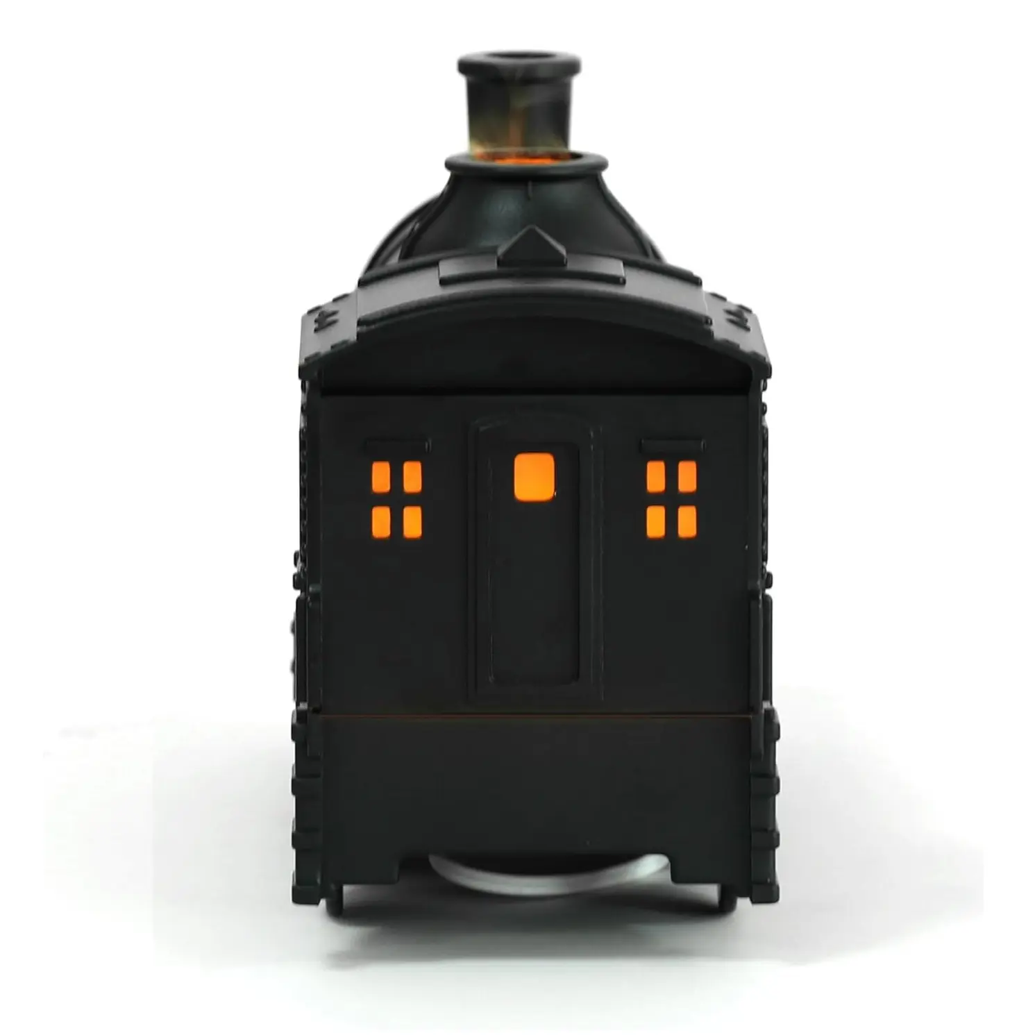 Humidificador negro diseño de locomotora con luz LED naranja brillante iluminando ventanas y chimenea.