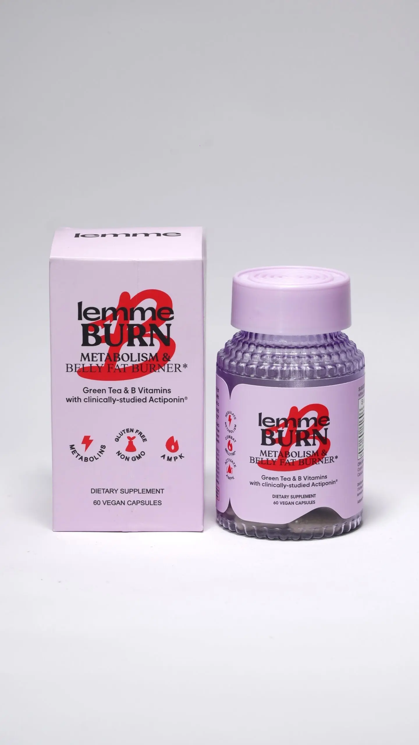 Frasco morado texturizado con tapa rosada y su caja de empaque rosa claro de cápsulas veganas para el metabolismo.