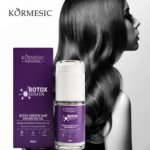 Aceite capilar Kormesic Botox Keratina de 60 ml en envase morado junto a su caja, formulado para fortalecer la raíz y reducir la caída del cabello.
