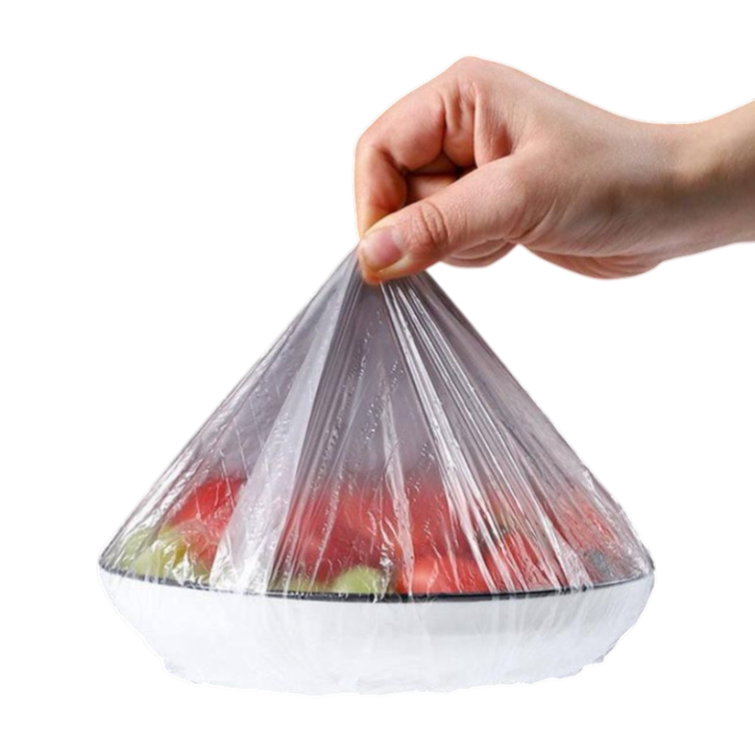 Mano sosteniendo una tapa elástica transparente sobre un tazón con frutas, ideal para conservar alimentos frescos y reemplazar el plástico de un solo uso.