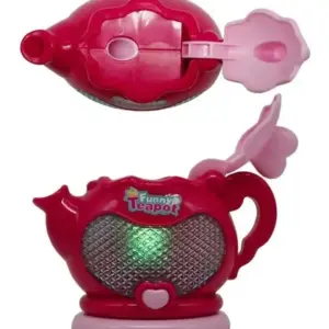 Tetera de juguete color fucsia con luz verde central, tapa abierta y diseño de corazón, mostrada en vista superior y lateral con detalles en rosa claro.