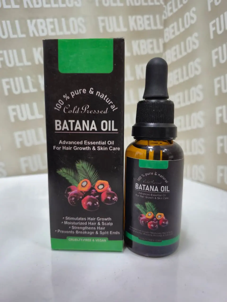 Aceite de batana puro en frasco de vidrio ámbar con gotero y caja negra con detalles verdes para el crecimiento y cuidado capilar.