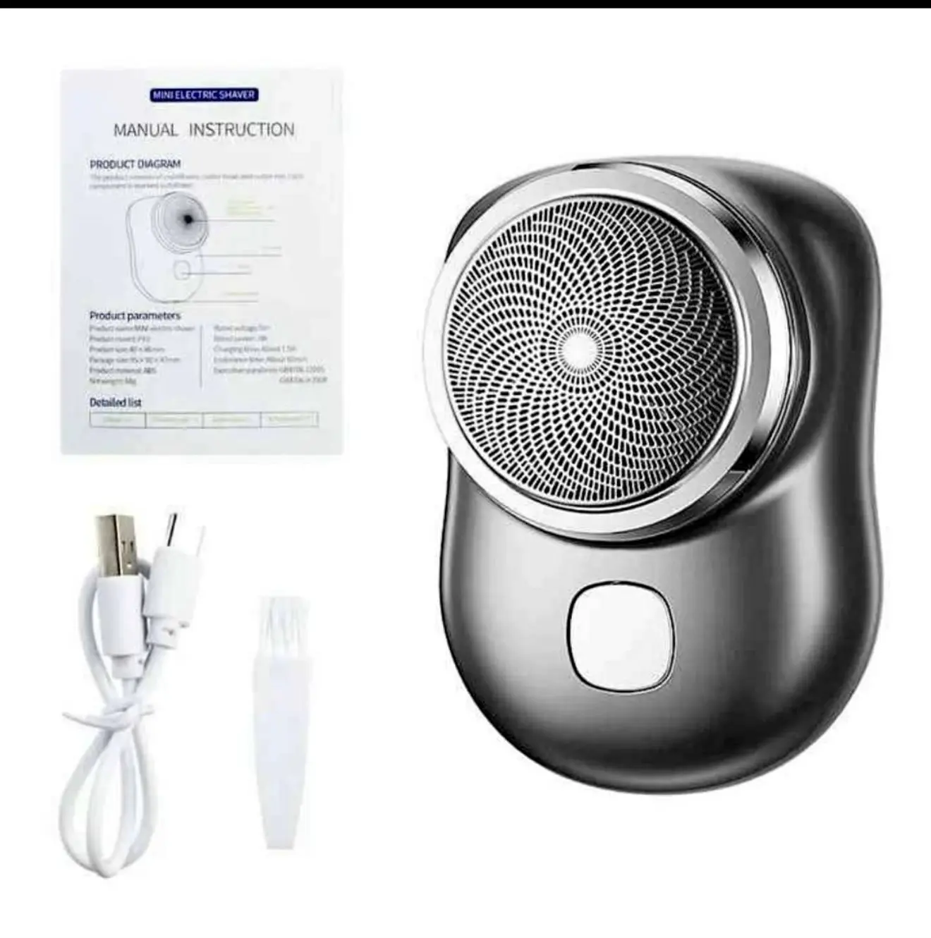 Mini afeitadora eléctrica portátil gris con lámina circular, incluye cable USB, cepillo limpiador y manual de instrucciones.