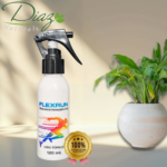 Botella blanca de spray de 120 ml con etiqueta de corredor multicolor, sobre fondo beige con planta en maceta