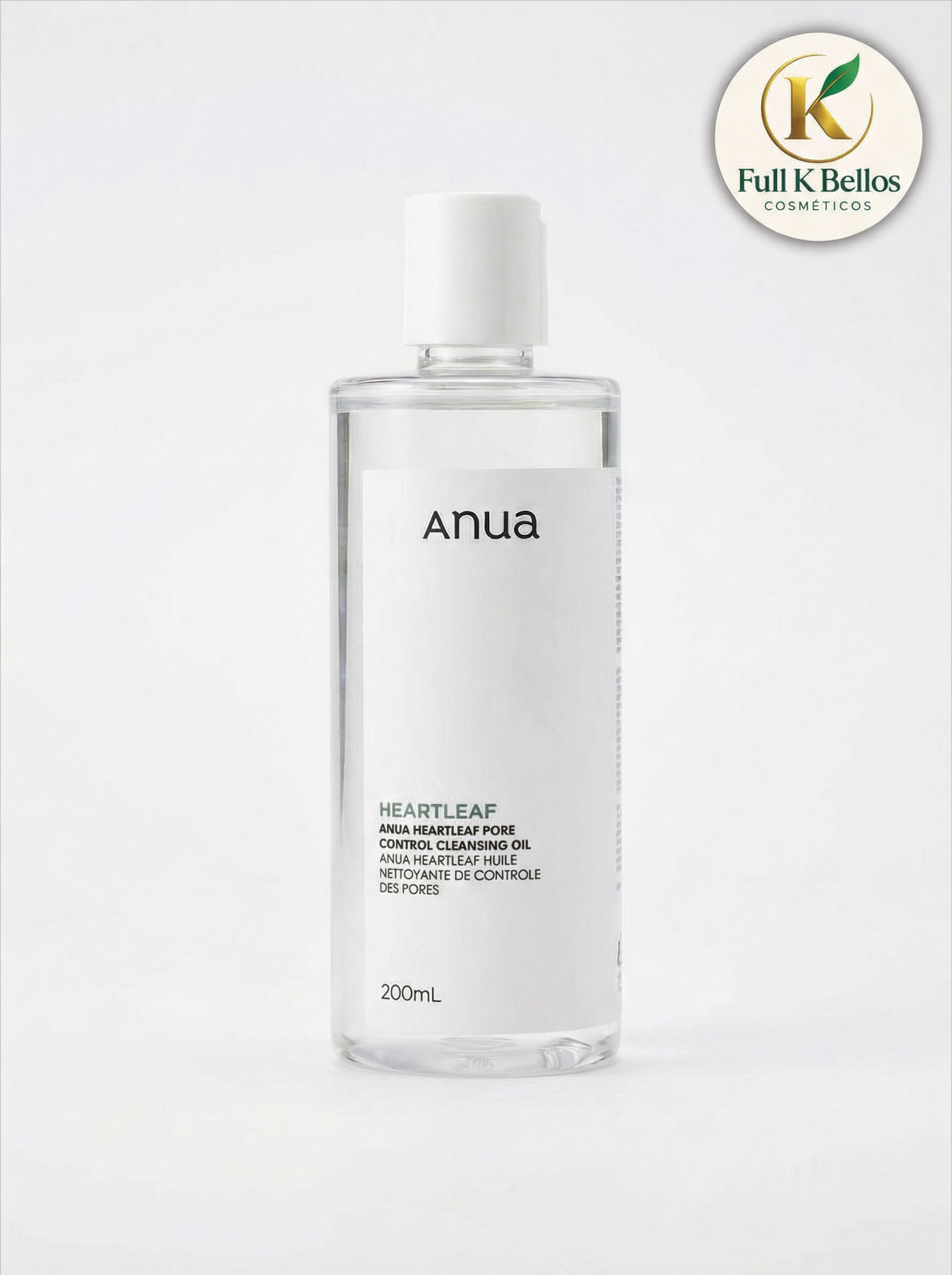 Envase cilíndrico transparente de 200ml con limpiador facial Anua Heartleaf Pore Cleansing Oil, etiqueta blanca minimalista y tapa dosificadora blanca.