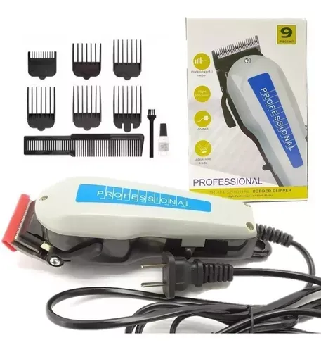 Cortadora de cabello eléctrica gris y negra con cable, cuchilla roja y caja que incluye 6 peines guía, peine, aceite y cepillo.