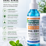 Enjuague bucal TheraBreath sin alcohol sabor menta helada, botella con dispensador de bomba, líquido azul, hojas de menta y cubos de hielo.