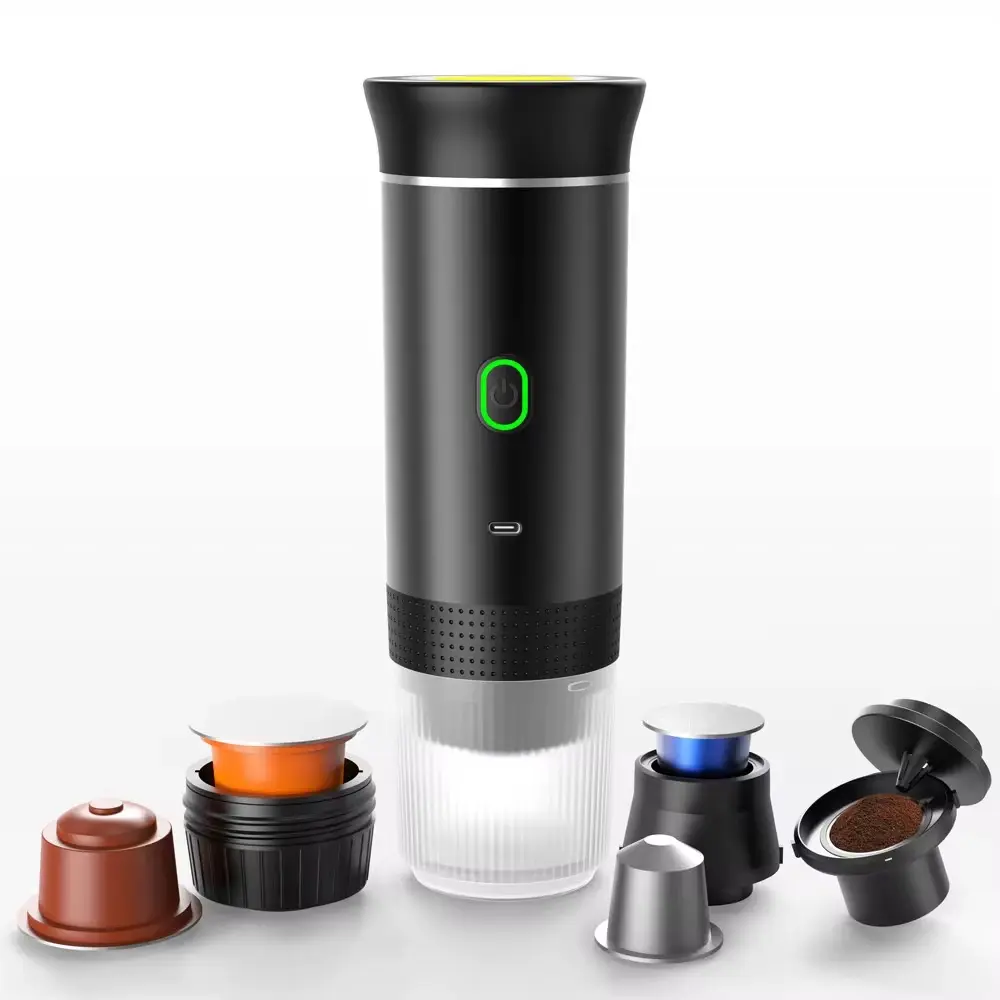 Cafetera portátil espresso negra cilíndrica con botón iluminado, base transparente y accesorios intercambiables para cápsulas y café molido.