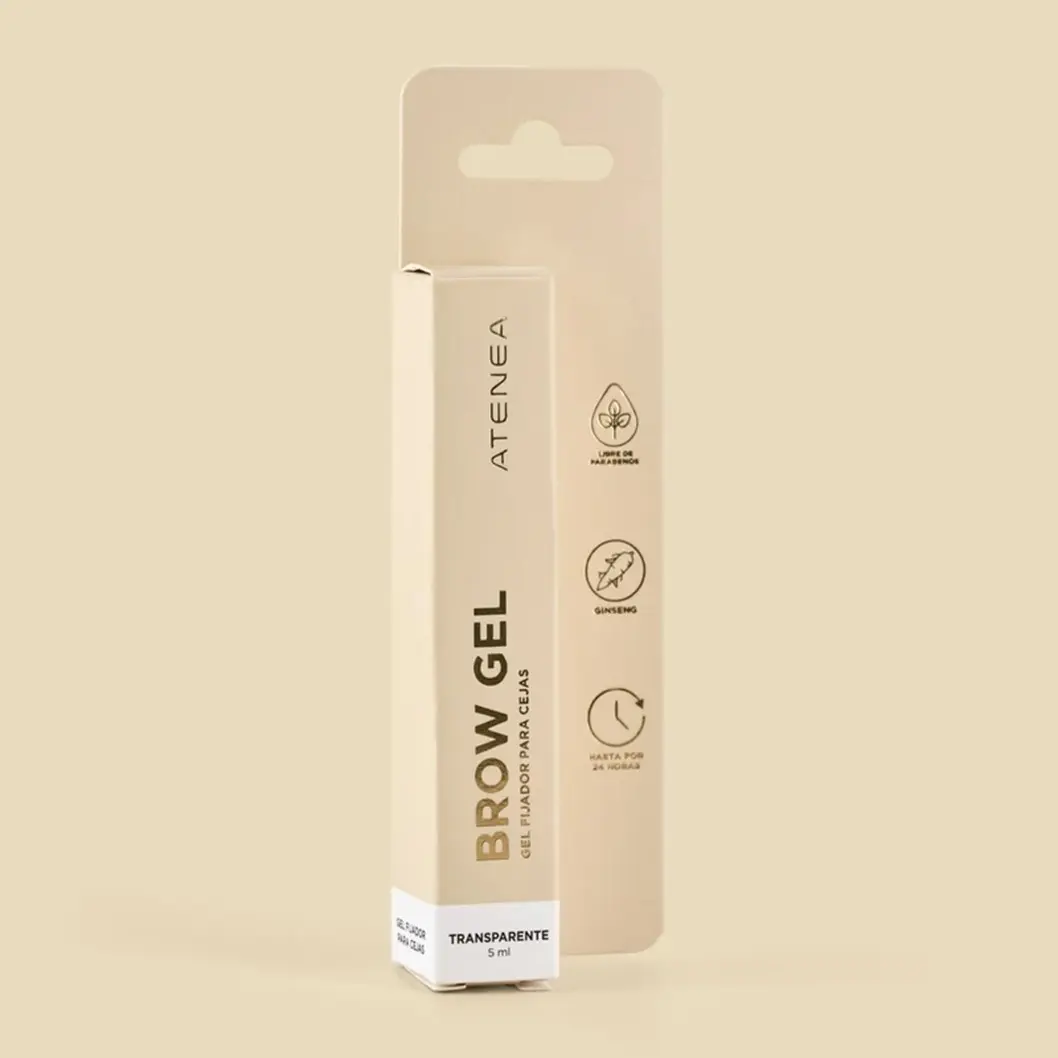 Gel fijador de cejas Atenea transparente de 5 ml en caja blanca frente a su empaque de cartón beige con iconos, sobre fondo crema.