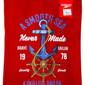 Camiseta Speedo roja de algodón para hombre con diseño marino de ancla y timón impresos en el centro.