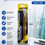 Cortador de vidrio profesional ámbar de 15 cm con punta tipo diamante, mango alargado translúcido, gotero dispensador y empaque blíster negro y amarillo.