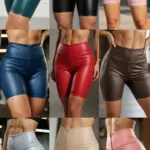 Pack de 12 bikers de cuero sintético con cierre frontal para mujer en diversos colores como verde, negro, rosa, azul, rojo y marrón.