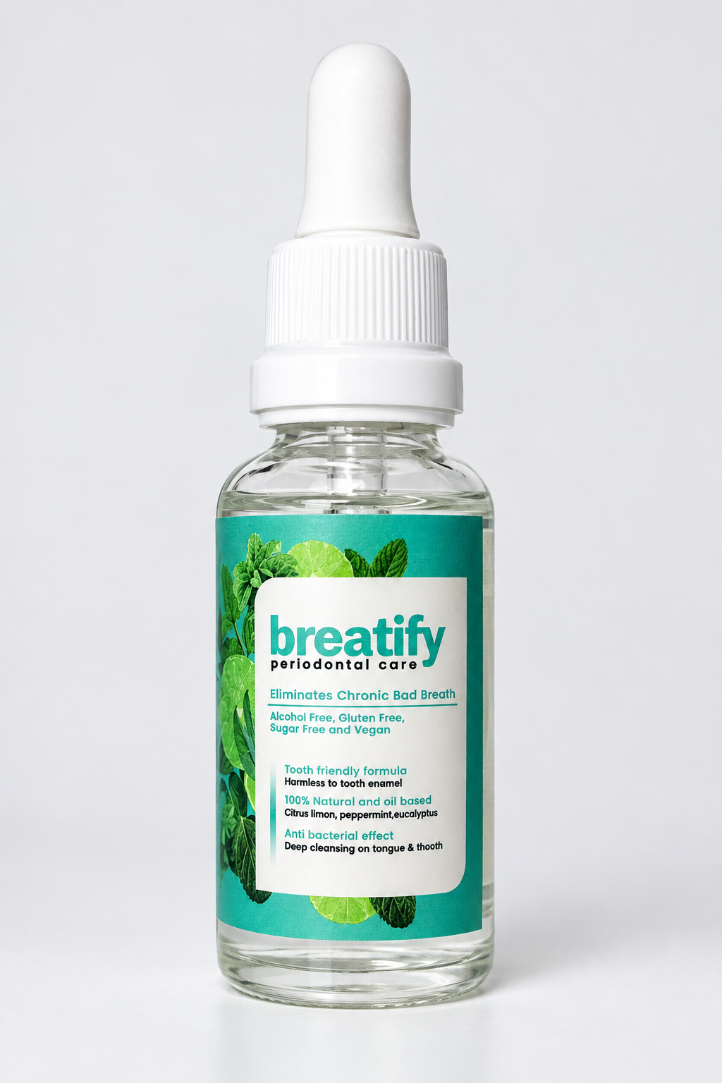 Frasco de vidrio transparente con gotero blanco que contiene suero bucal natural con etiqueta verde e ingredientes cítricos y de menta.