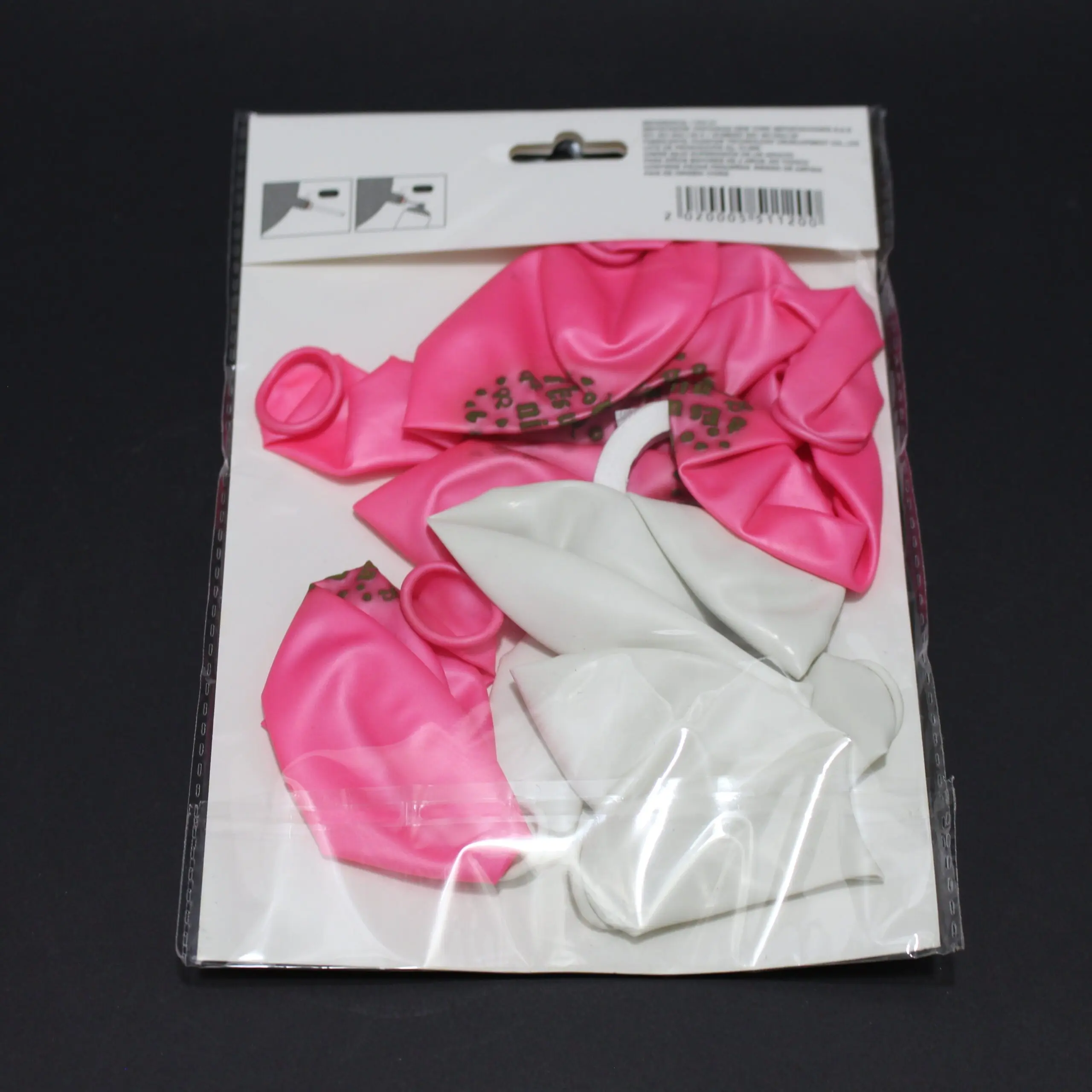 Set de globos para revelación de género en colores rosa con puntos y blanco, contenidos en empaque plástico transparente con cabezal blanco.