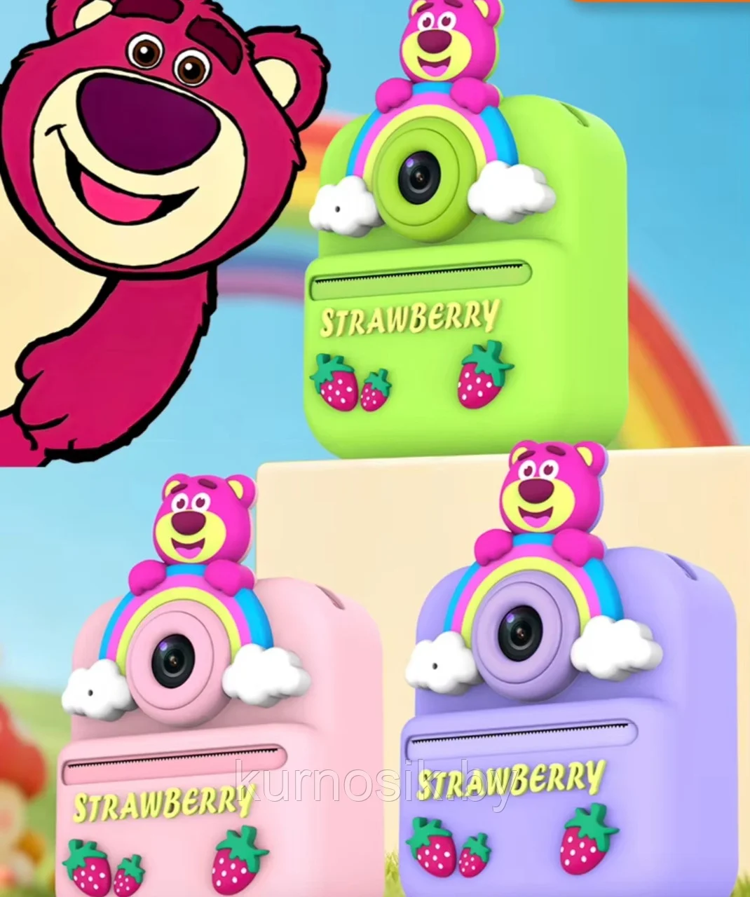 Cámara instantánea infantil con diseño de oso rosado sobre arcoíris y nubes, disponible en verde, rosado y lila con detalles de fresas.